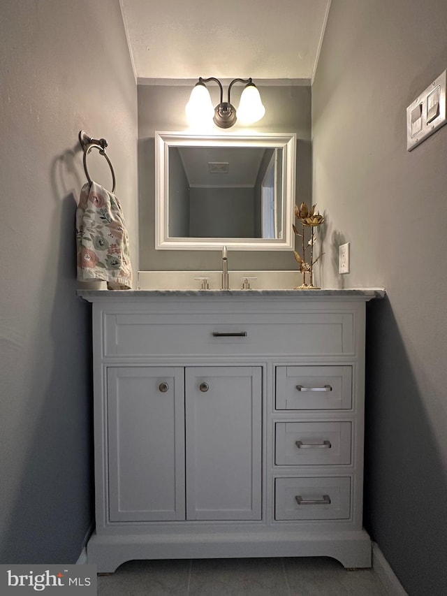 bathroom featuring vanity and ornamental molding