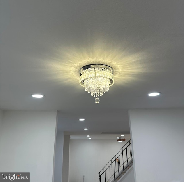 room details featuring recessed lighting and a notable chandelier