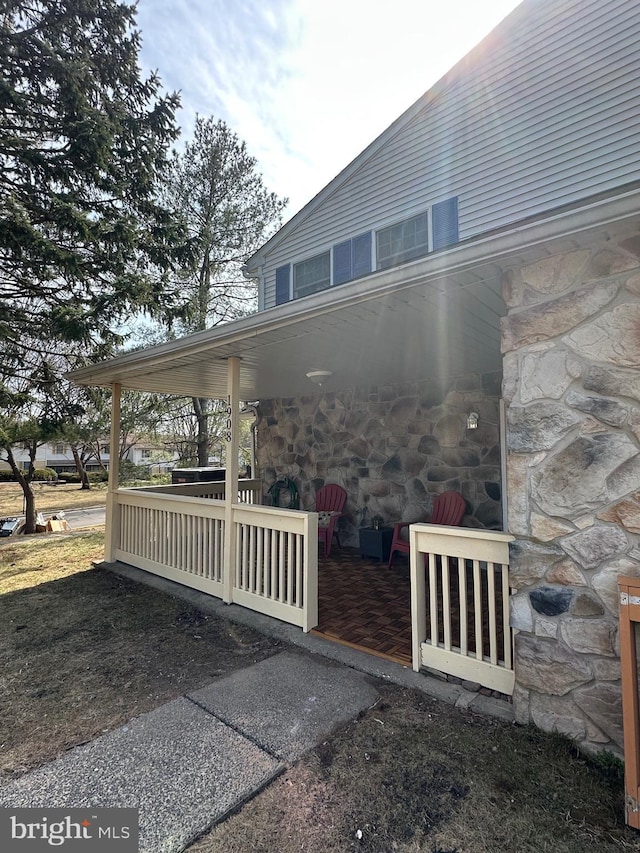 view of property exterior with stone siding