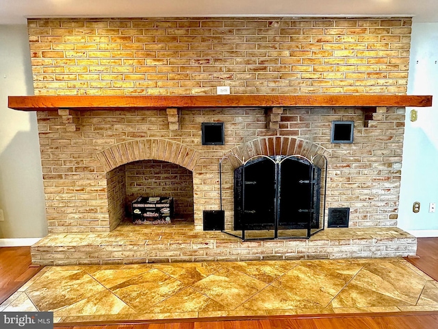 interior space with a brick fireplace