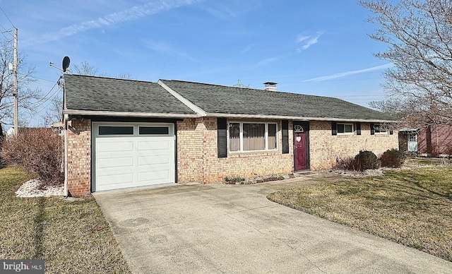 ranch-style house featuring brick siding, driveway, an attached garage, and roof with shingles