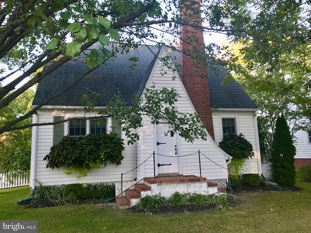 901 S Talbot, Saint Michaels, MD 21663 - exterior space featuring a shingled roof and a chimney