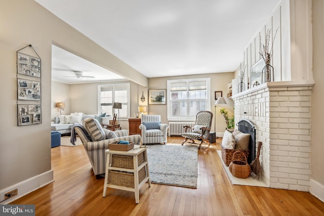 901 S Talbot, Saint Michaels, MD 21663 - living room featuring wood-type flooring, radiator, and ceiling fan