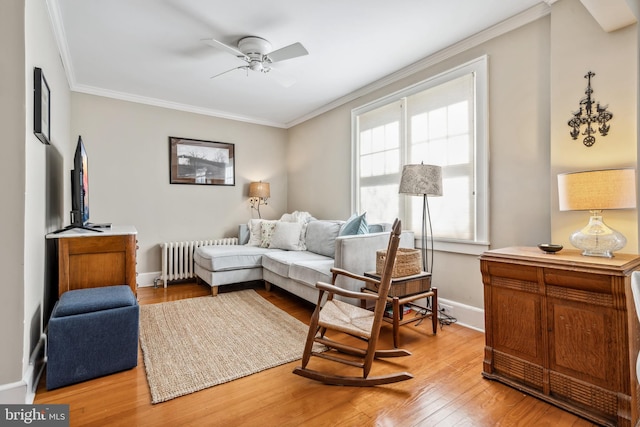 901 S Talbot, Saint Michaels, MD 21663 - sitting room featuring radiator heating unit, baseboards, a ceiling fan, and ornamental molding