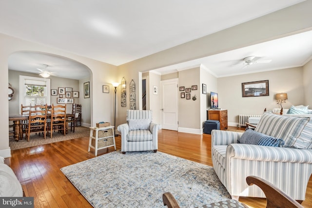 901 S Talbot, Saint Michaels, MD 21663 - living room with baseboards, radiator, ceiling fan, arched walkways, and wood-type flooring
