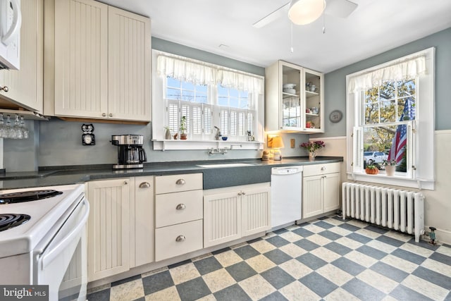 901 S Talbot, Saint Michaels, MD 21663 - kitchen featuring a sink, a wealth of natural light, a ceiling fan, white appliances, and radiator