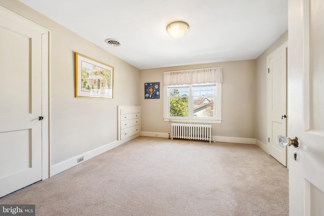 901 S Talbot, Saint Michaels, MD 21663 - unfurnished bedroom featuring radiator heating unit, visible vents, baseboards, and carpet floors