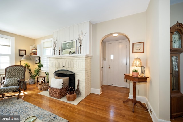 901 S Talbot, Saint Michaels, MD 21663 - interior space with arched walkways, wood finished floors, a fireplace, and baseboards