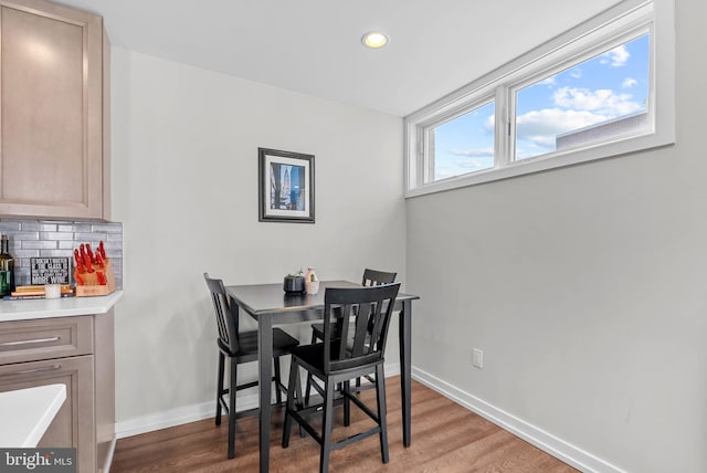 dining area with recessed lighting, wood finished floors, and baseboards