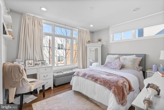 bedroom featuring recessed lighting and wood finished floors