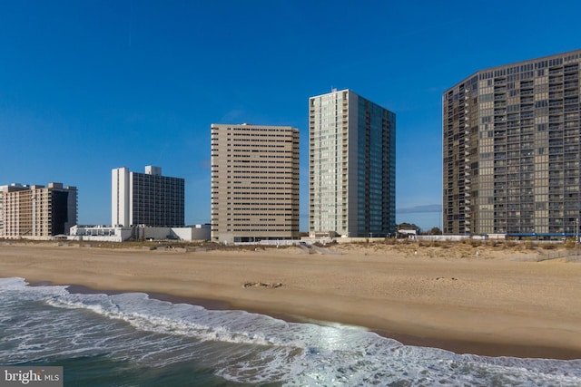 city view featuring a water view and a view of the beach