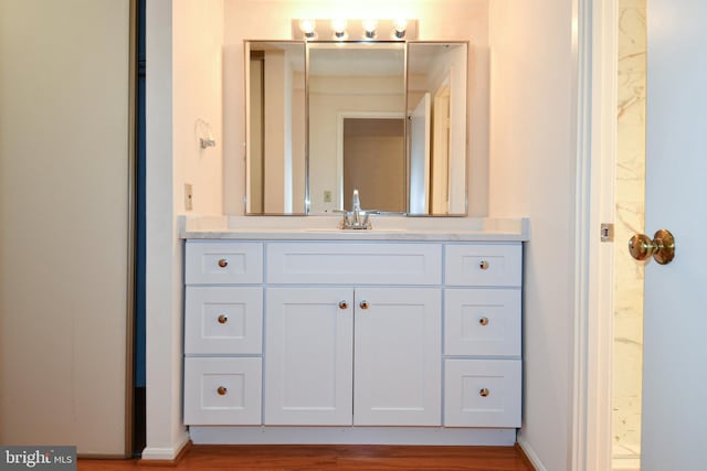 bathroom featuring vanity and baseboards