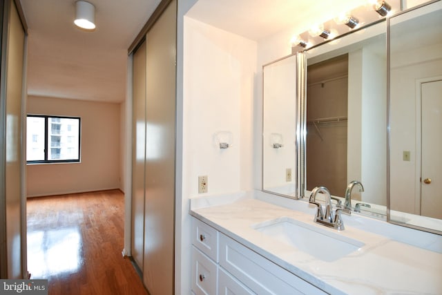 bathroom featuring vanity and wood finished floors