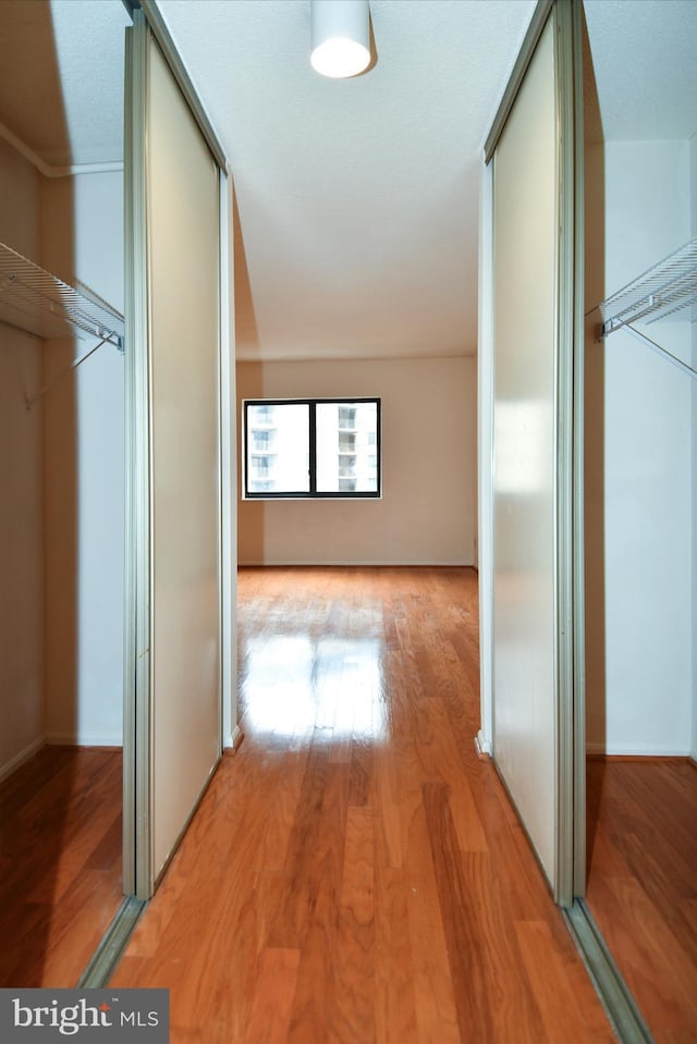 hallway with light wood-type flooring