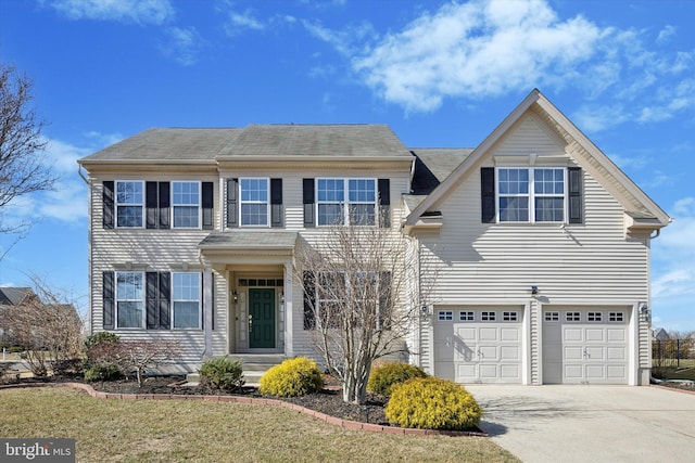 view of front of house with a garage and concrete driveway