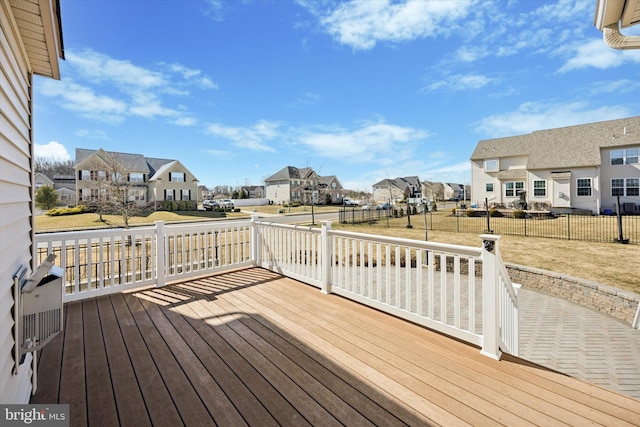 deck featuring a residential view and fence