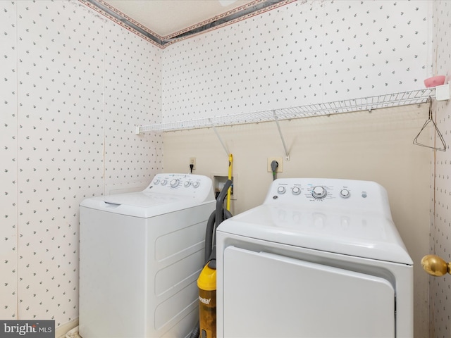 laundry room with washer and clothes dryer and laundry area