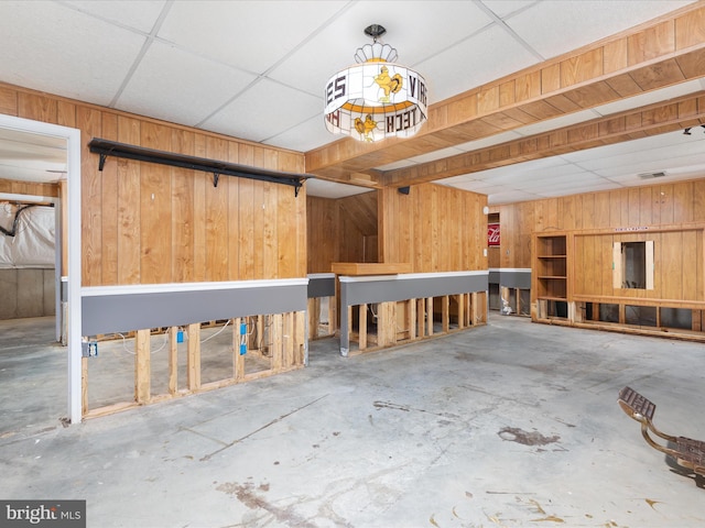 garage featuring wooden walls