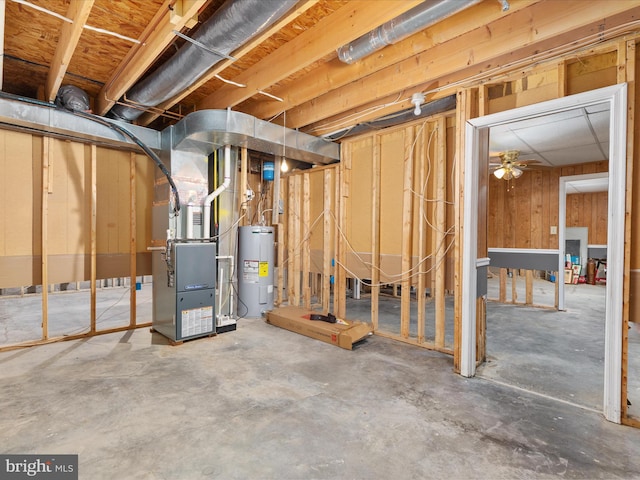 unfinished below grade area featuring heating unit and electric water heater