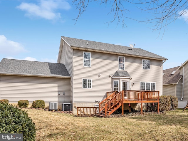 back of house featuring cooling unit, a yard, a wooden deck, and stairway