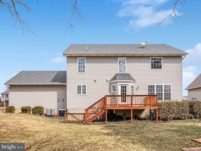 back of house featuring a shingled roof, stairway, a wooden deck, a lawn, and cooling unit