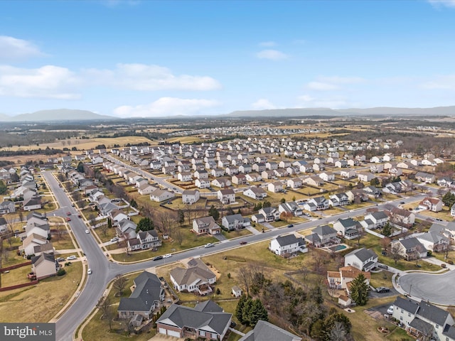 birds eye view of property featuring a mountain view and a residential view