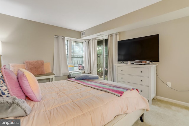 bedroom featuring visible vents, access to outside, light colored carpet, and baseboards