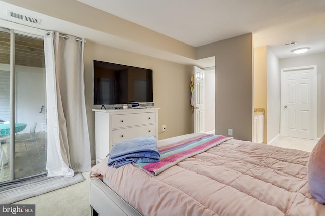 carpeted bedroom featuring visible vents and access to outside