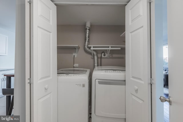 laundry room featuring laundry area and washing machine and clothes dryer