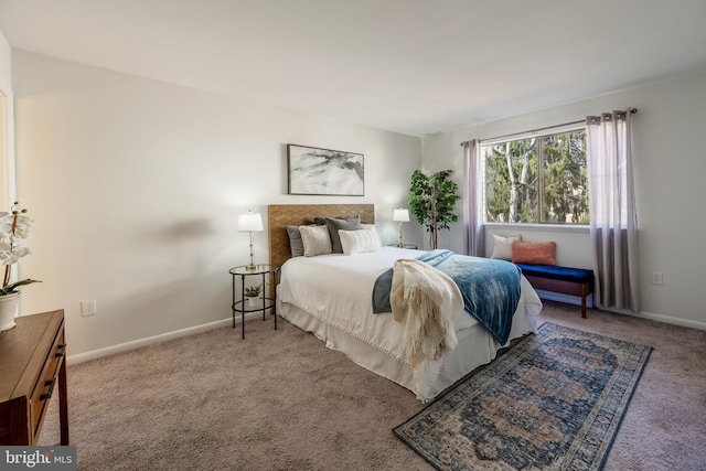 bedroom with carpet and baseboards