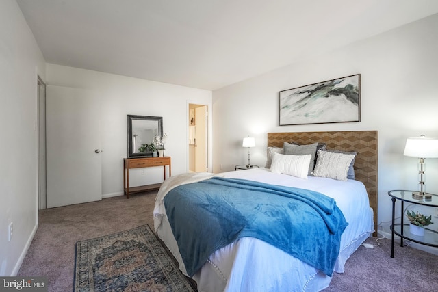 carpeted bedroom with baseboards