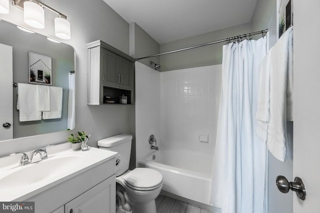 bathroom with vanity, toilet, and shower / bathtub combination with curtain