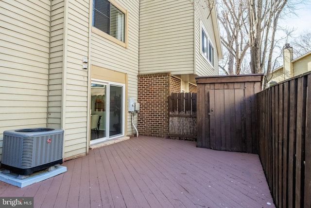 deck with central air condition unit and fence