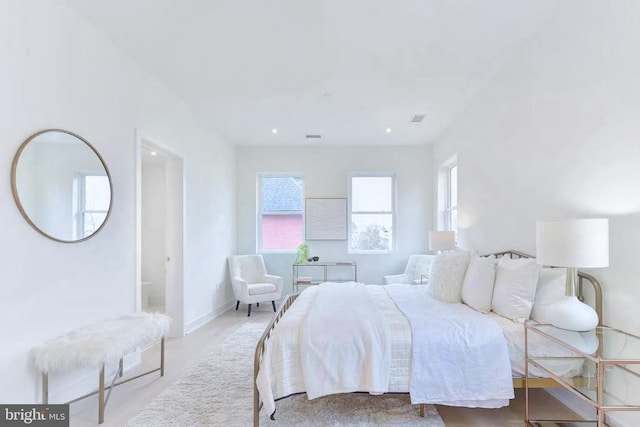 bedroom with visible vents and baseboards