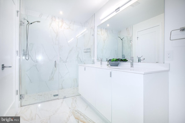 bathroom featuring double vanity, a marble finish shower, marble finish floor, and recessed lighting