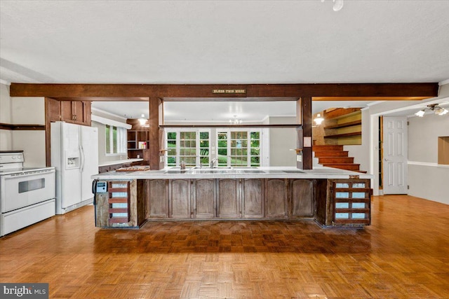 306 Burnt Church Rd, Winchester, VA 22603 - kitchen with light countertops, a chandelier, a textured ceiling, white appliances, and beamed ceiling