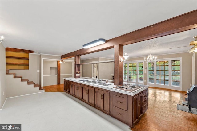 306 Burnt Church Rd, Winchester, VA 22603 - kitchen with light countertops, a sink, ceiling fan with notable chandelier, and stainless steel electric stovetop