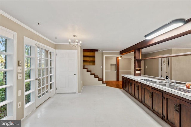 306 Burnt Church Rd, Winchester, VA 22603 - interior space featuring light countertops, ornamental molding, dark brown cabinetry, a sink, and a notable chandelier
