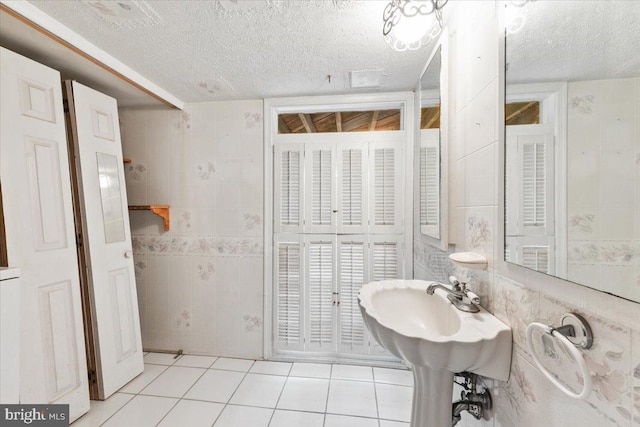 306 Burnt Church Rd, Winchester, VA 22603 - bathroom with tile walls, a textured ceiling, and tile patterned flooring