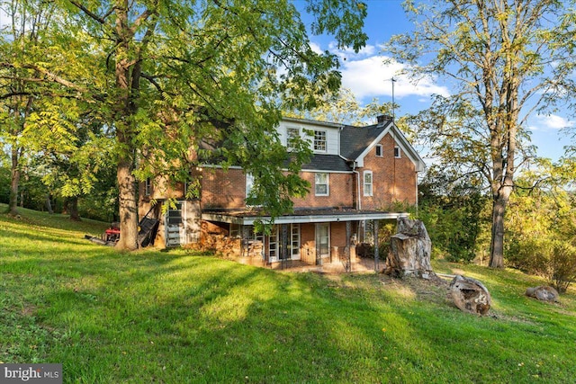 306 Burnt Church Rd, Winchester, VA 22603 - back of property featuring a lawn, brick siding, a chimney, and roof with shingles