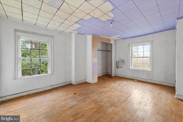 306 Burnt Church Rd, Winchester, VA 22603 - unfurnished bedroom featuring hardwood / wood-style floors and multiple windows