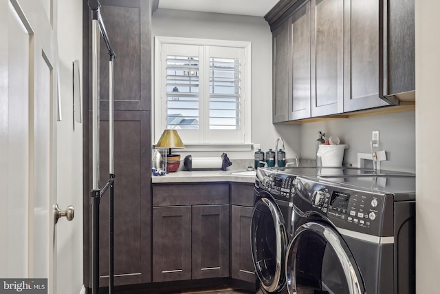 laundry area featuring cabinet space and separate washer and dryer