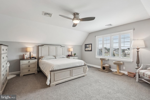 carpeted bedroom with lofted ceiling, baseboards, visible vents, and ceiling fan