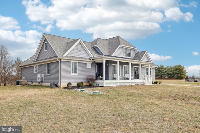 view of front of home featuring covered porch, a front yard, and a shingled roof