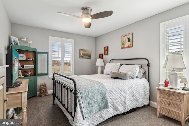 bedroom with baseboards, ceiling fan, and carpet flooring