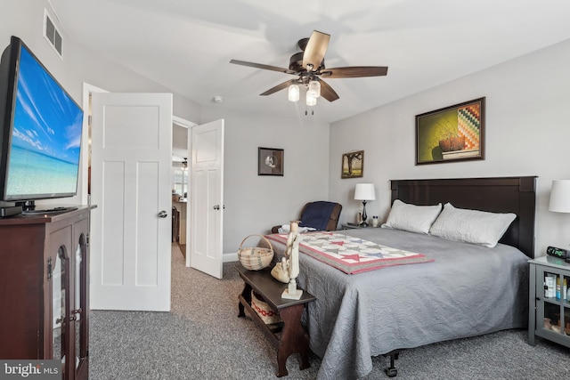 carpeted bedroom with visible vents and a ceiling fan