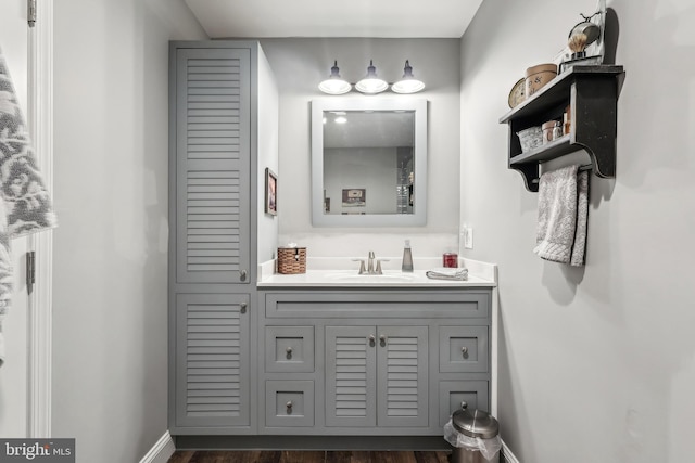 bathroom with vanity and baseboards