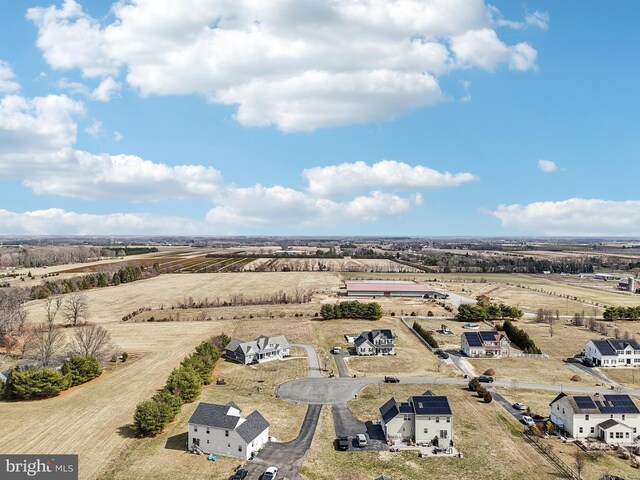 birds eye view of property featuring a rural view