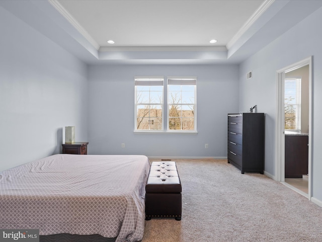 bedroom featuring multiple windows, a raised ceiling, carpet, and baseboards