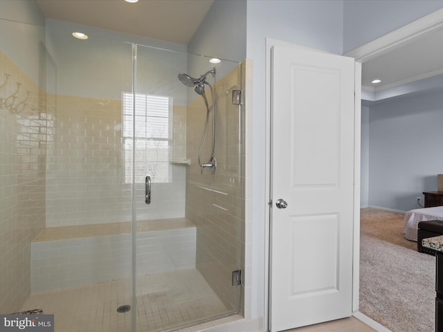 bathroom featuring recessed lighting and a shower stall